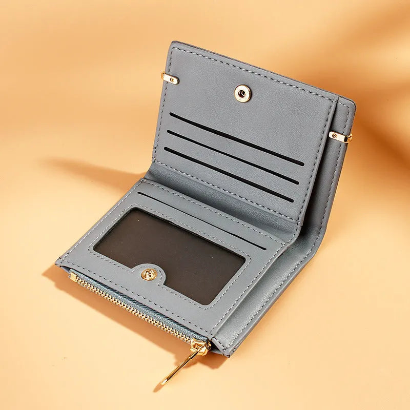 A closed ladies short zipper wallet in PU leather, showing its compact 2-fold design.