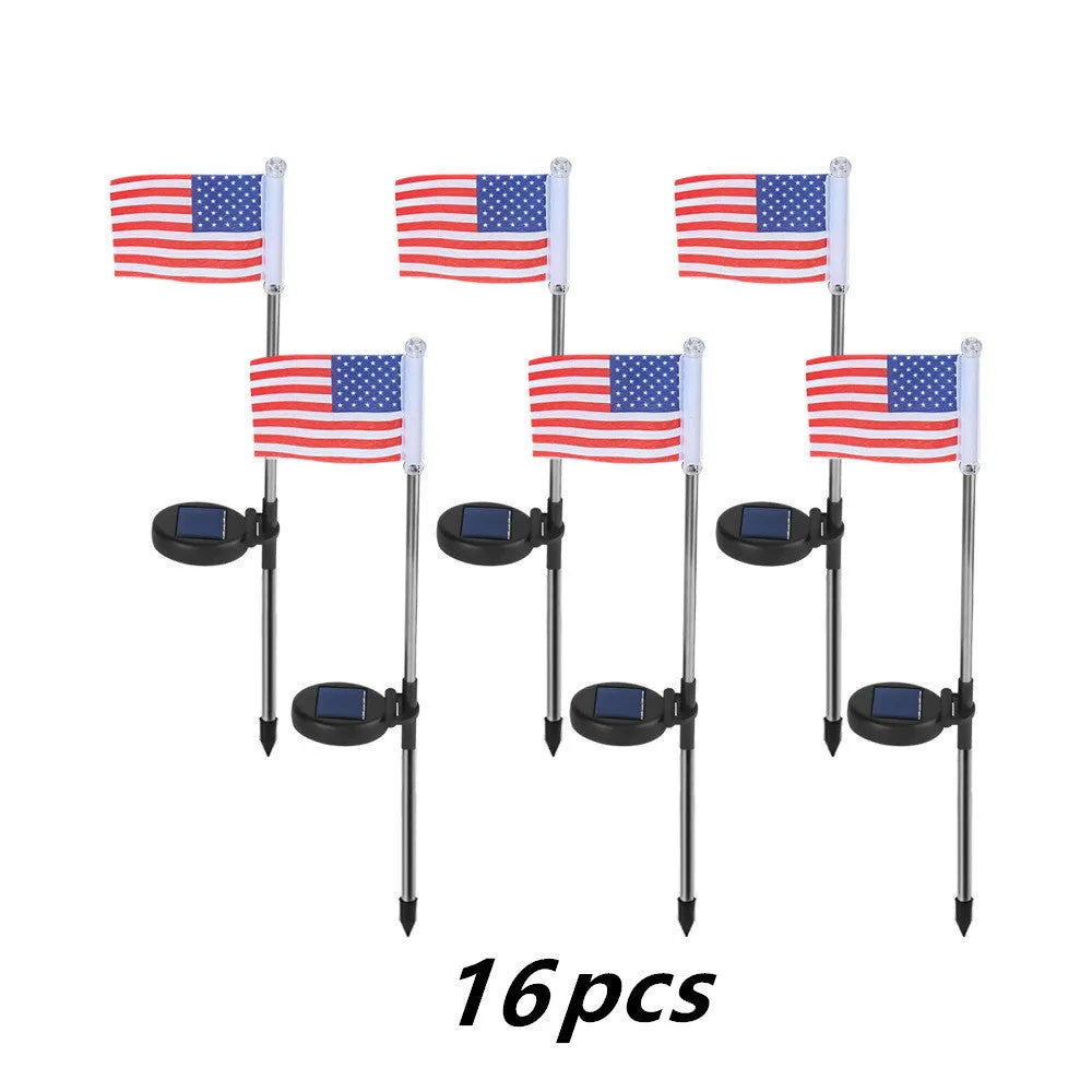 Solar-powered garden flag light displaying either American or British flag design with stainless steel pole and solar panel