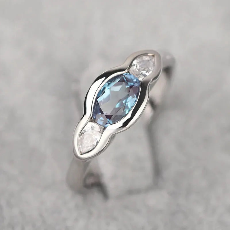 Geometric ellipse women's ring with white gold colour and inlaid zircon detailing on finger
