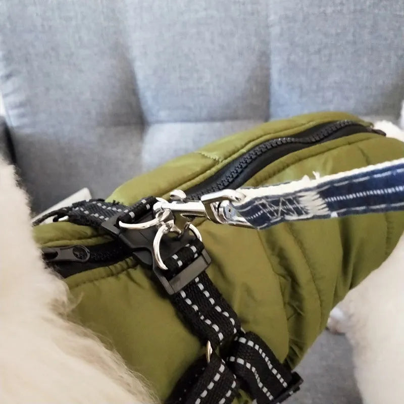 Waterproof dog coat with integrated harness in red, shown on a dog