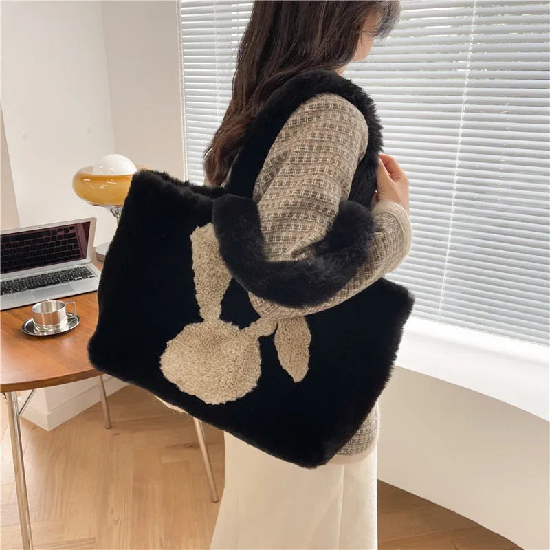 Plush shoulder bag with cartoon rabbit ears design in solid colour options