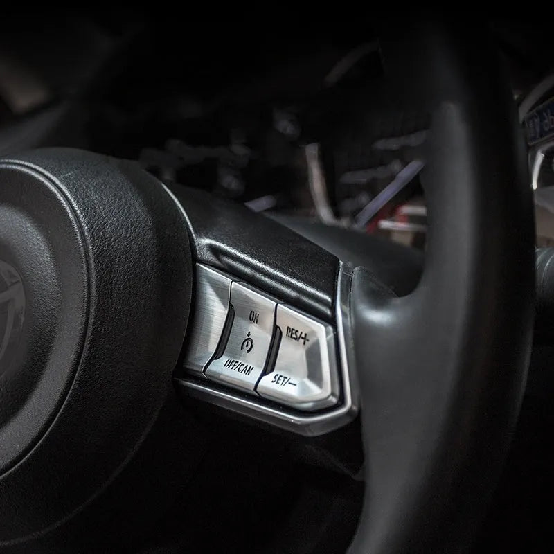 Aluminium alloy decorative stickers for car steering wheel buttons in brushed red, silver, and blue colours