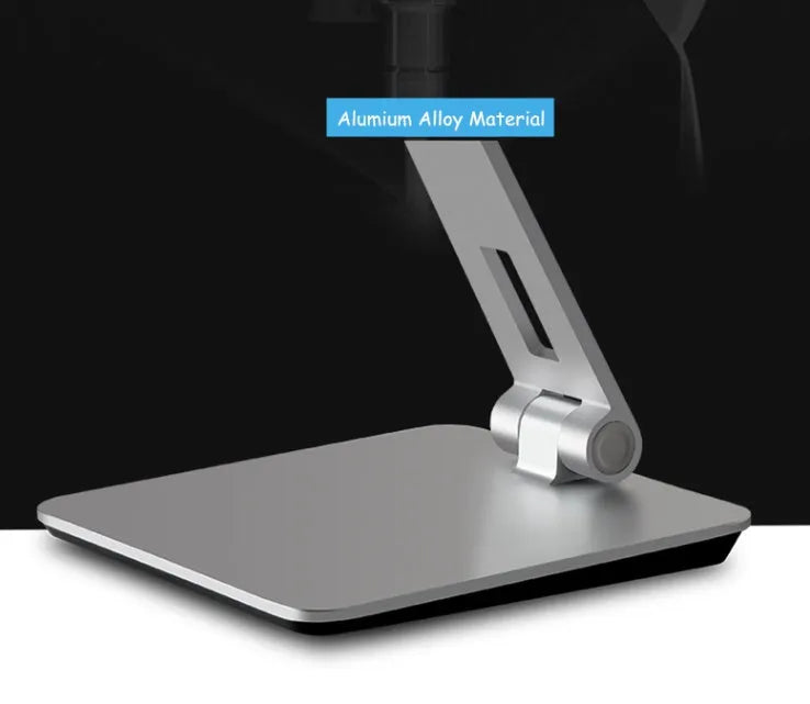 Folding aluminium desktop phone and tablet stand with 360-degree rotation on a wooden desk.