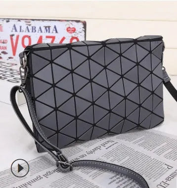Rhombic ABS shoulder bag in envelope style, available in multiple colours including black and pink.