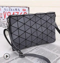 Rhombic ABS shoulder bag in envelope style, available in multiple colours including black and pink.