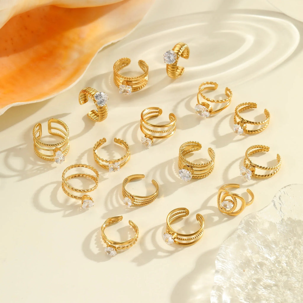 Stainless steel women's ring with gold electroplating and zircon details in geometry design