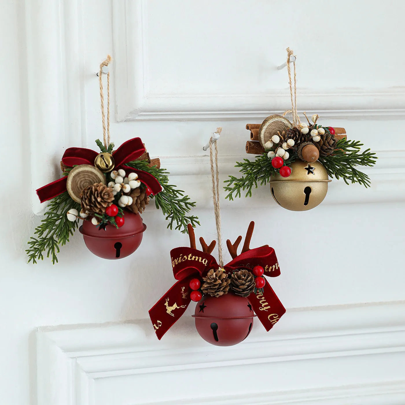Wrought iron mixed pendant with antlers, bowknot, pine cone, and bell in golden finish