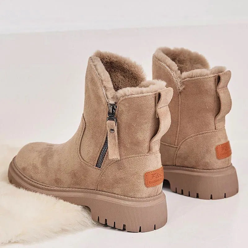 Women's black high-top snow boots with a side zipper and faux suede upper on a rubber sole.