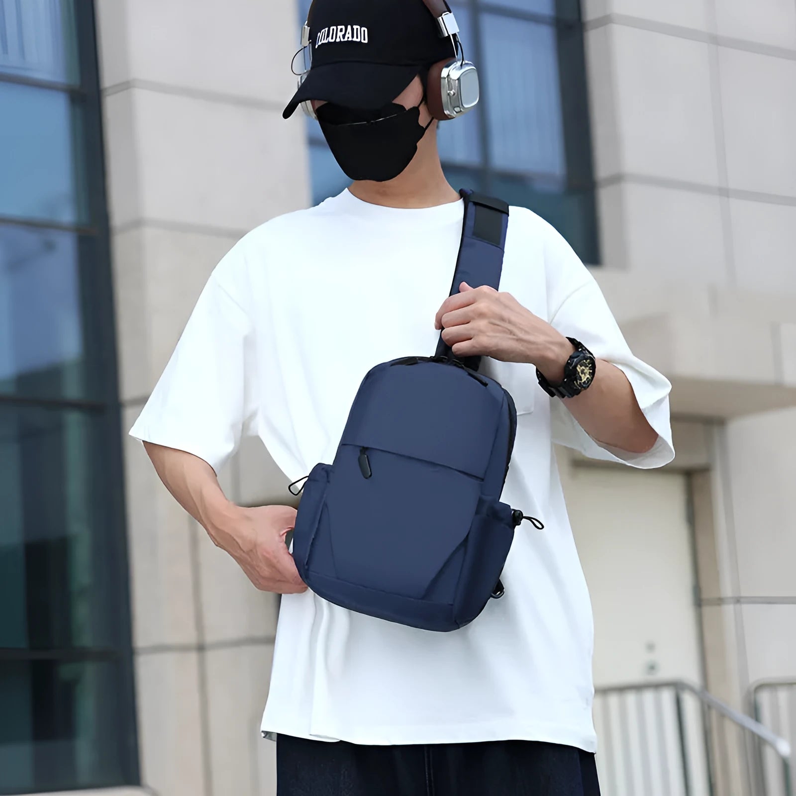 Men's grey waterproof chest bag showing front view with shoulder strap and large main compartment.