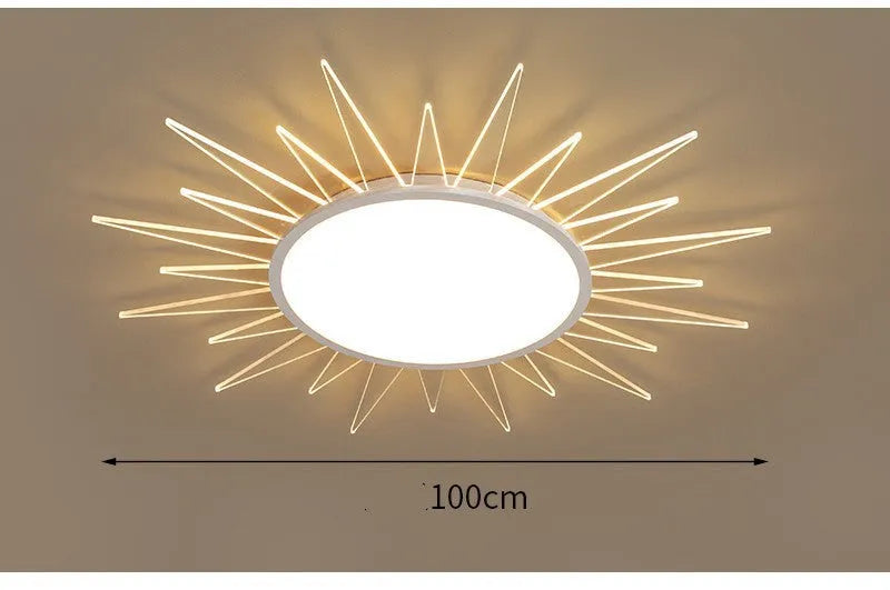 Modern round aluminium LED ceiling lamp with remote control on a white ceiling.