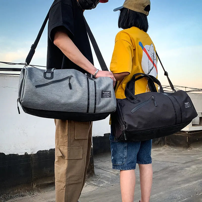 Cylindrical wet and dry sports gym bag in black with polyester texture and zippered pockets