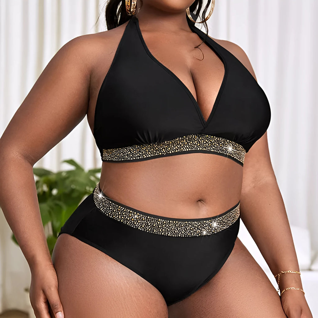 Black plus size women's bikini swimsuit with sleeveless bra and shorts on a mannequin.