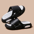 Two-colour couple slippers with thick EVA soles in black and white design