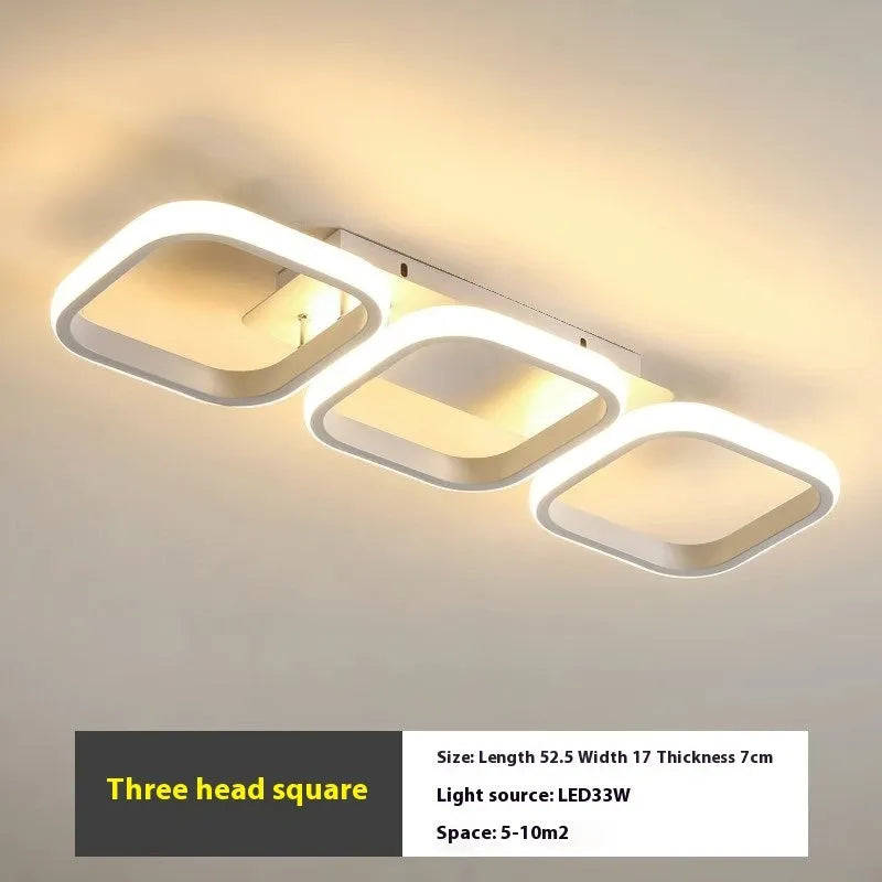 Modern simplicity hallway LED ceiling light in black with three round shapes over a corridor