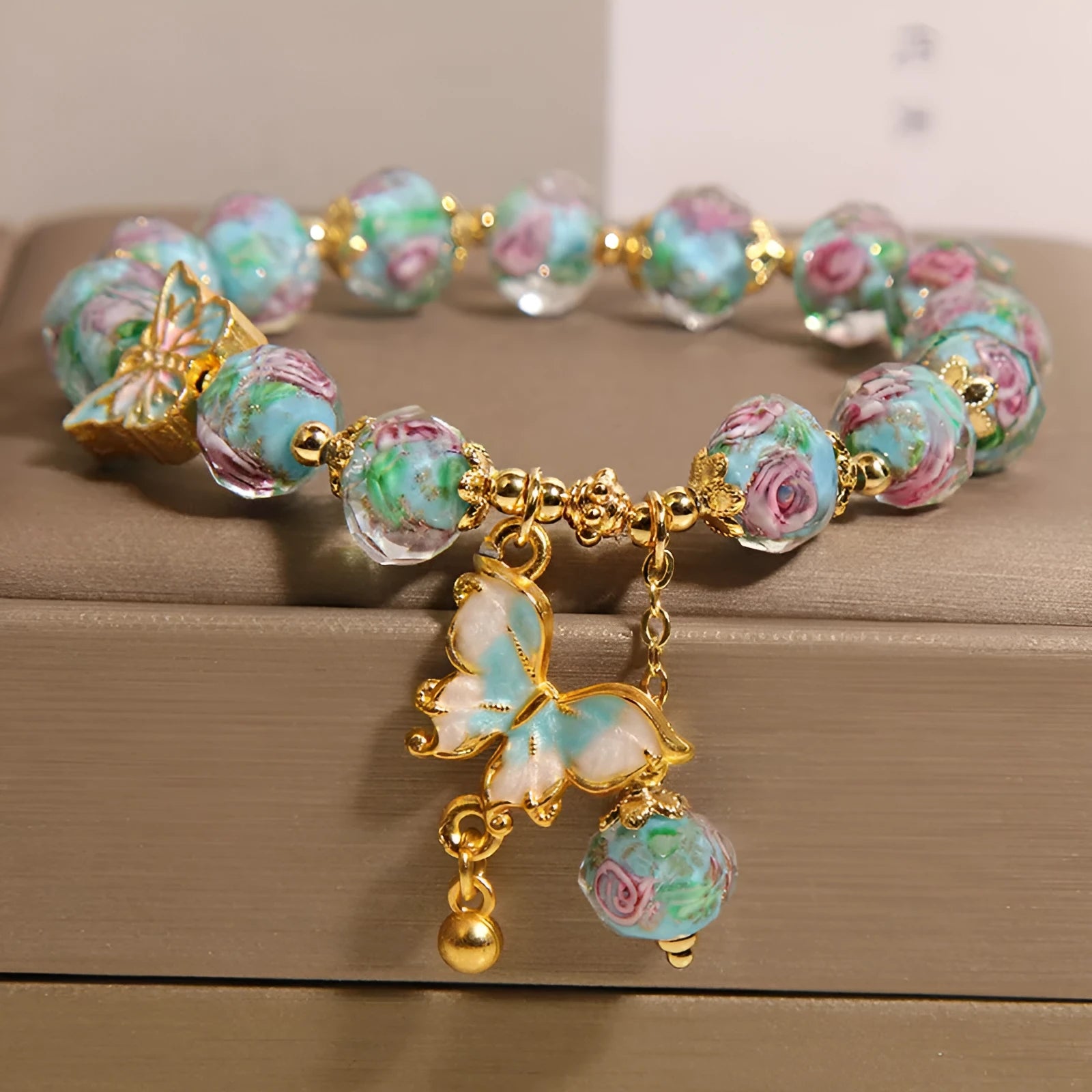 Women's rose garden bracelet with coloured glaze butterfly charm in blue, Japanese Korean style