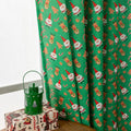 Christmas curtain with snowman and angel cartoon print in green, 1 metre length.