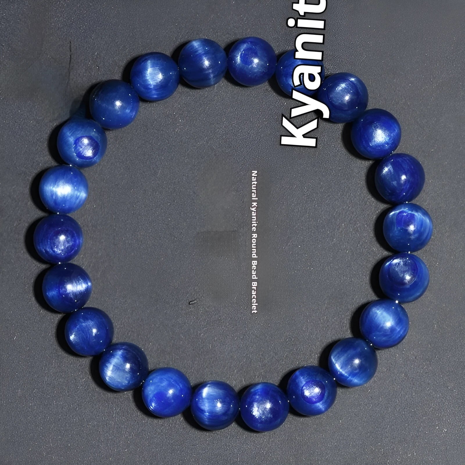 Natural blue crystal ball bracelet with geometric shape and Ruyi detail on a white background.