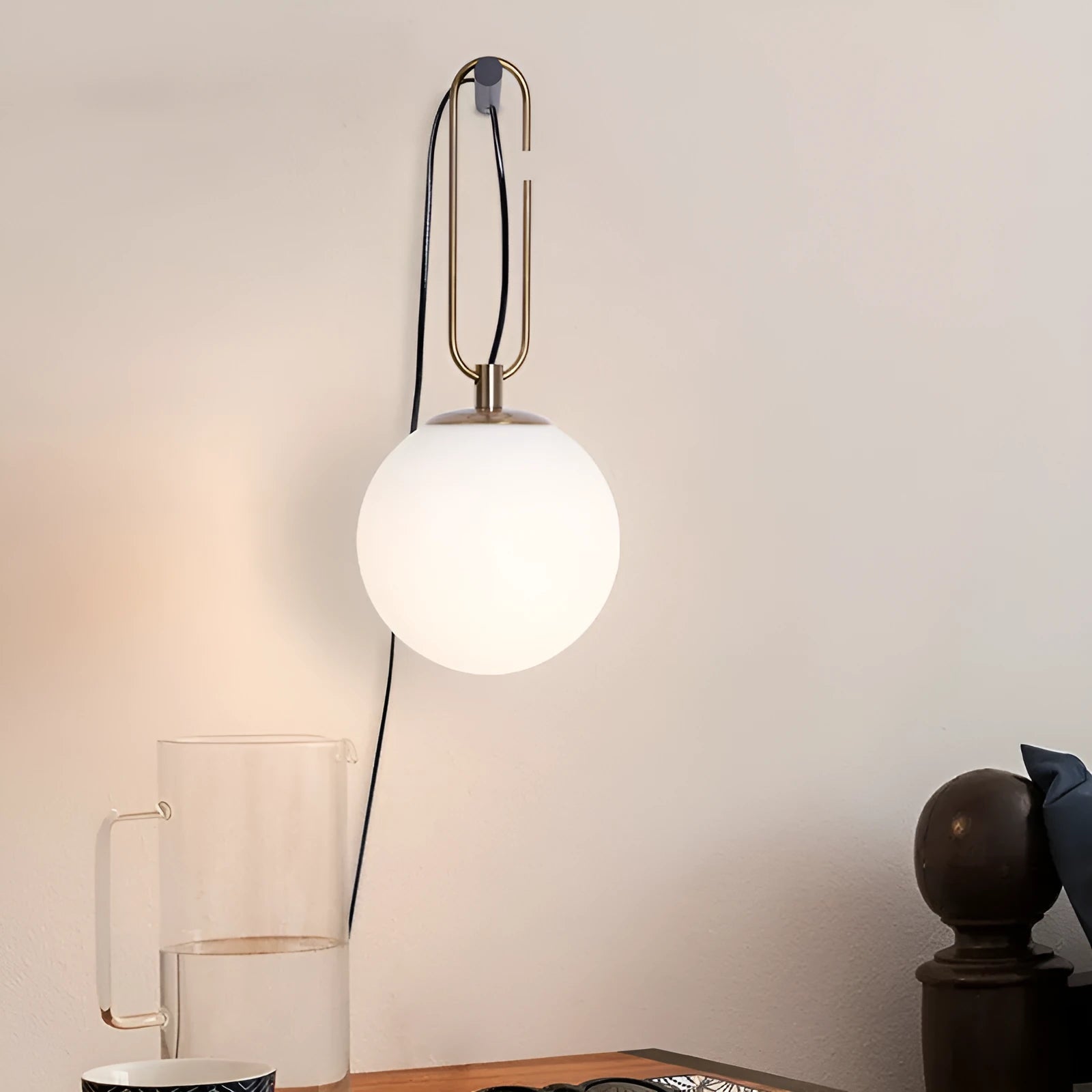 Modern Nordic glass wall lamp with three light colour options on a contemporary wall