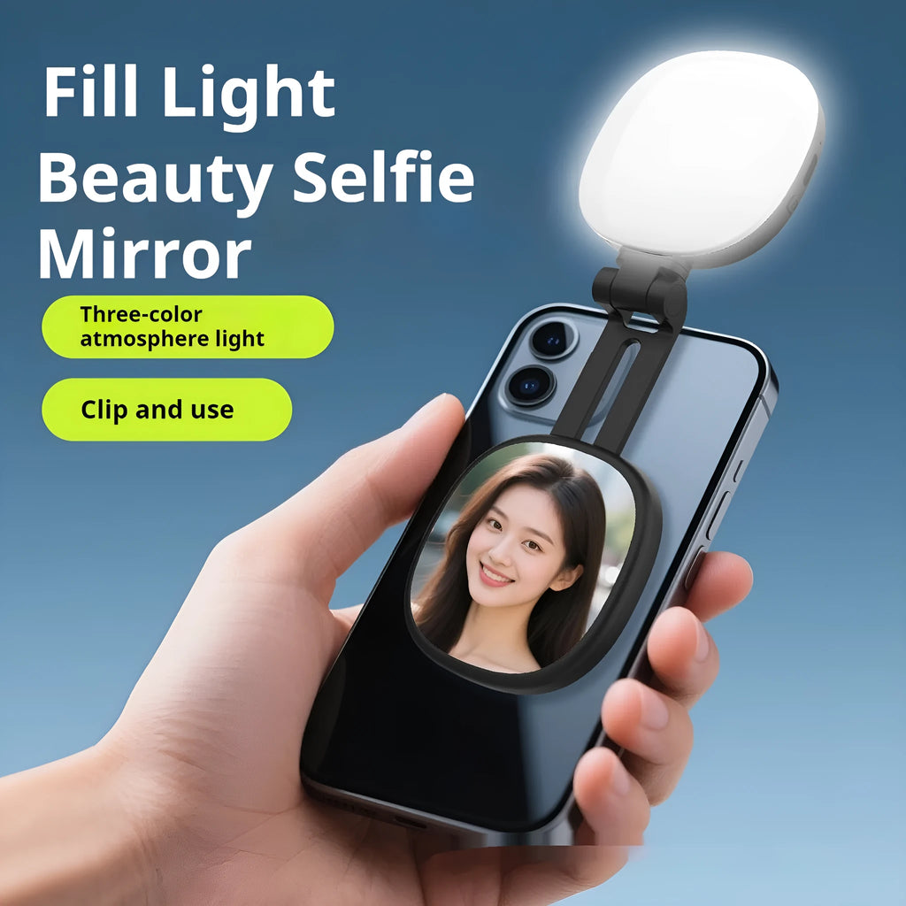 Black mini portable fill light with dial control magnetically attached to a mobile phone.