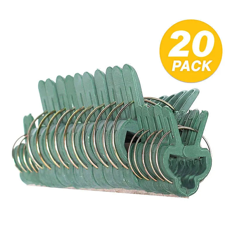 Green plastic plant fixing clips for supporting climbing vegetables like tomatoes and cucumbers