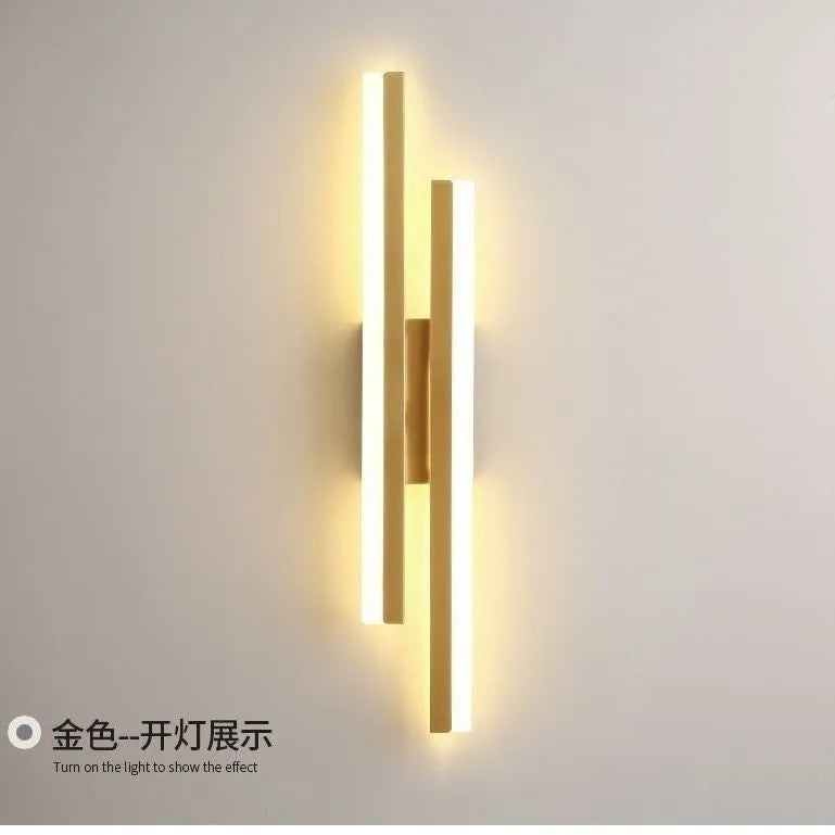 Modern Scandinavian minimalist LED wall light with acrylic shade in black or gold finish.