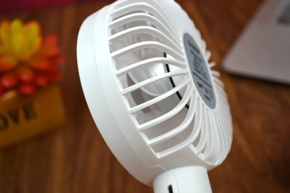White ORICO FH1 portable USB desk fan with fine line design on a desktop.