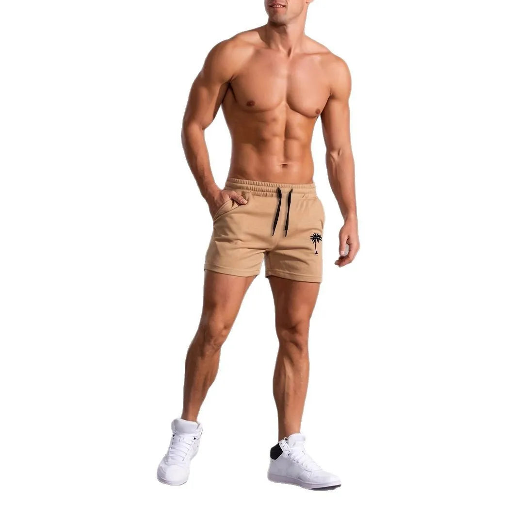 Khaki coloured men's sports shorts with coconut print design and straight cut for summer activities