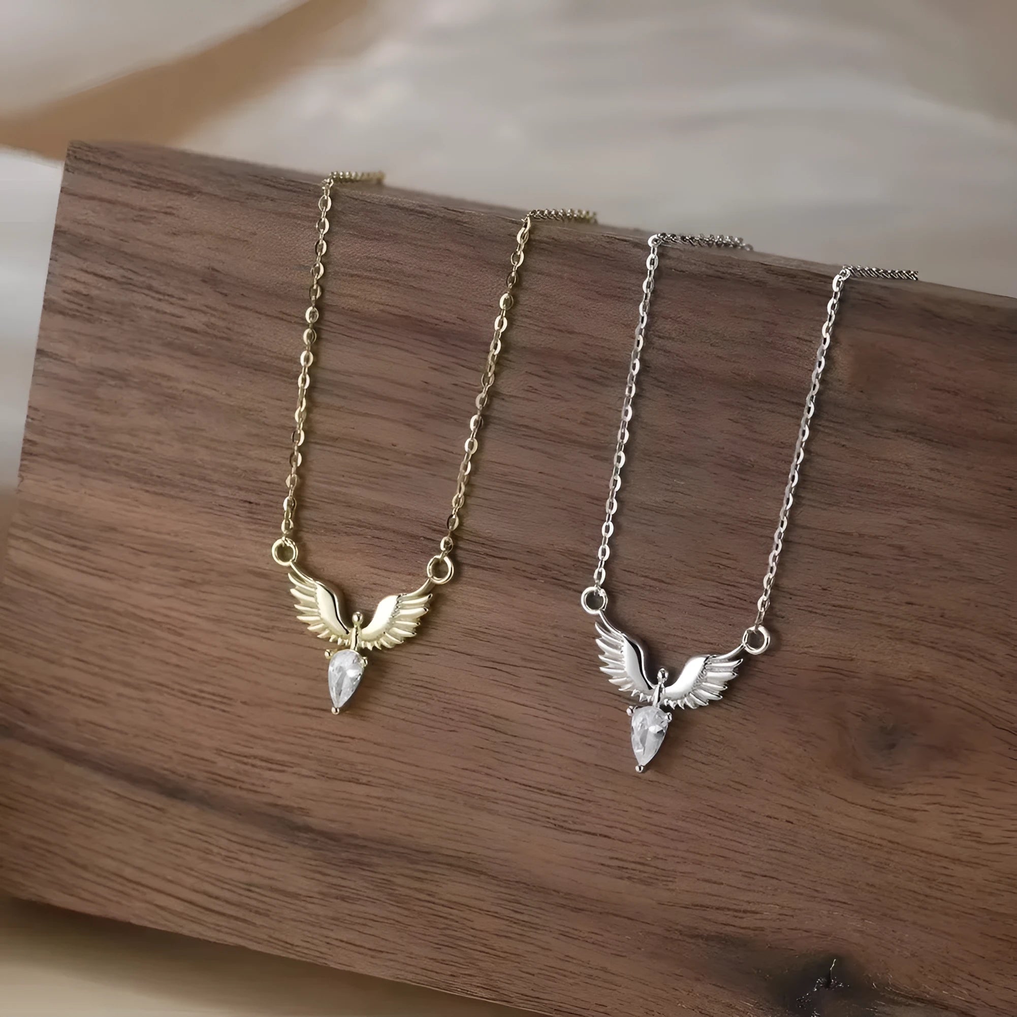 Sterling silver eagle pendant necklace on an adjustable O-ring chain with white gold or yellow gold finish.