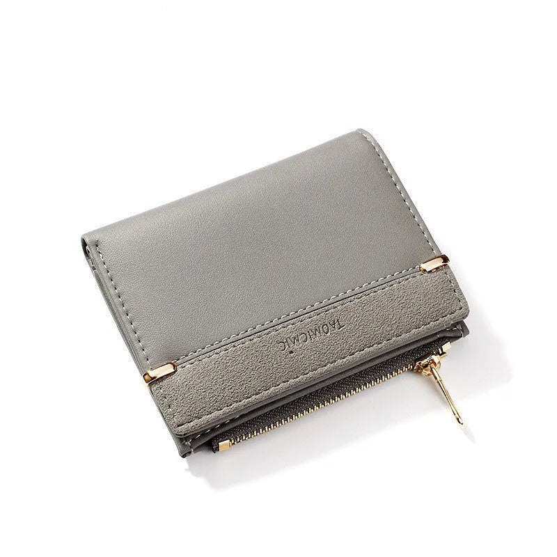 A closed ladies short zipper wallet in PU leather, showing its compact 2-fold design.