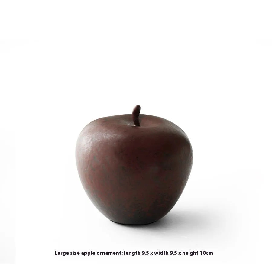 Ceramic apple decoration ornament on a desk, shown in large and small size options.