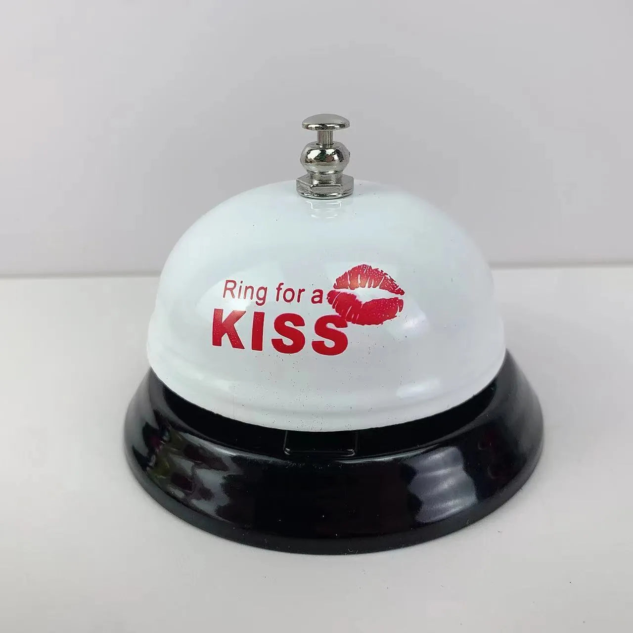 A multi-colour iron hand bell for games, classrooms, or restaurant service.