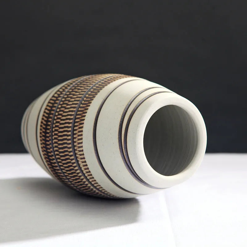 Three-piece ceramic vase set in low, medium, and tall sizes with vintage finish on a tabletop