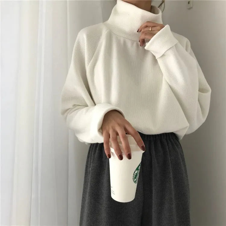 Women's solid colour polyester top with a half-high collar and long sleeves in a loose fit.