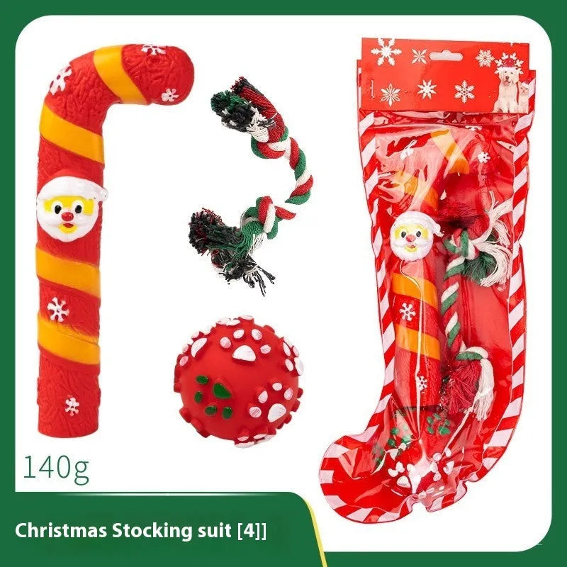 Christmas vinyl dog toy set with Santa Claus heads, trees, tennis balls, and bite ropes