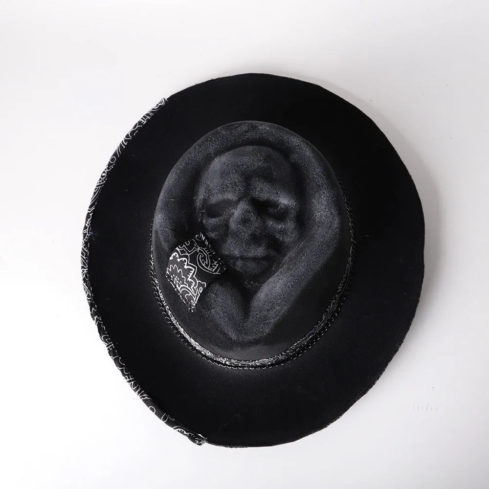 Handmade wool felt skull hat with a conical crown on a model, shown in the skull hat colour variant.