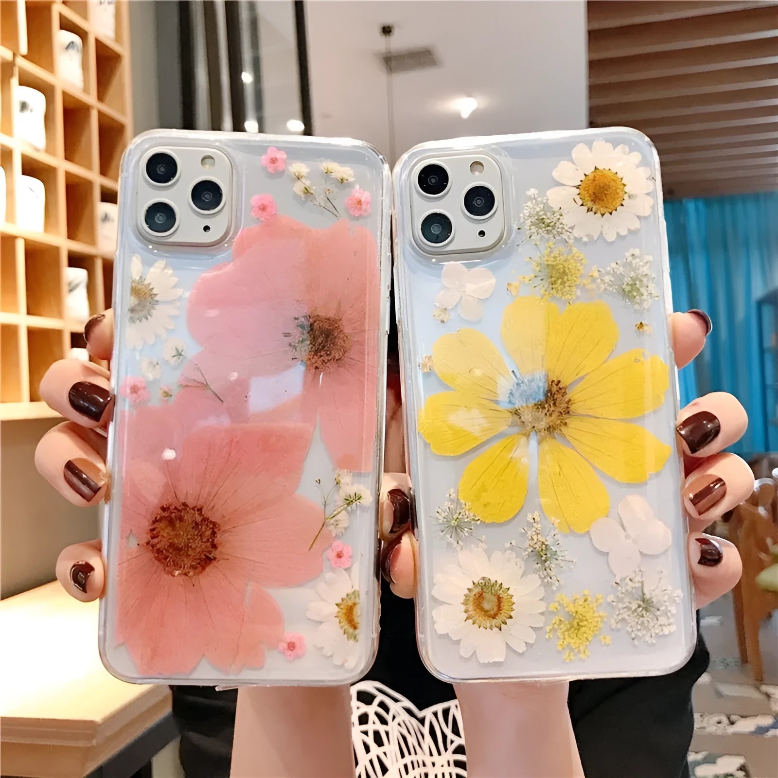 iPhone phone case with a large pink floral design on a flexible TPU back cover.
