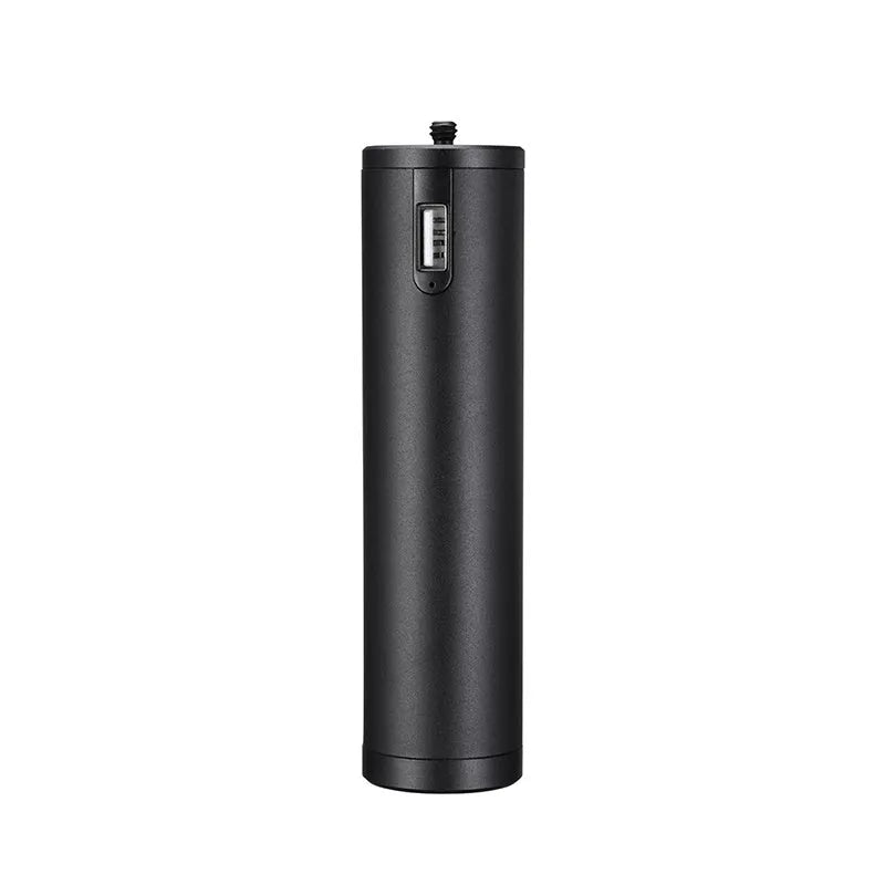Black aluminium alloy portable power bank with handle, showing compact size next to a mobile phone for scale.