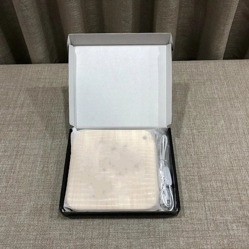 Square pine wood USB lamp emitting a warm white 3D patterned light on a surface.