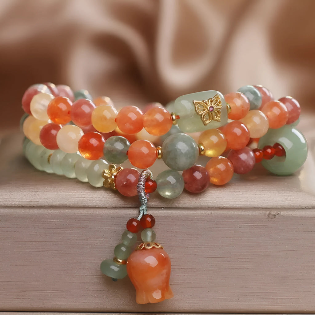 Natural Jinsi Jade multi-circle bracelet with round beads and lily pendant on display