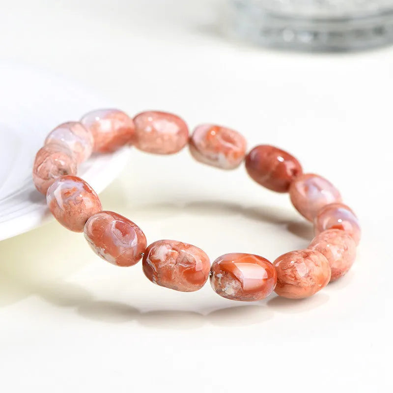 Natural cherry agate barrel bead bracelet with 10x14mm geometry and Ruyi design elements