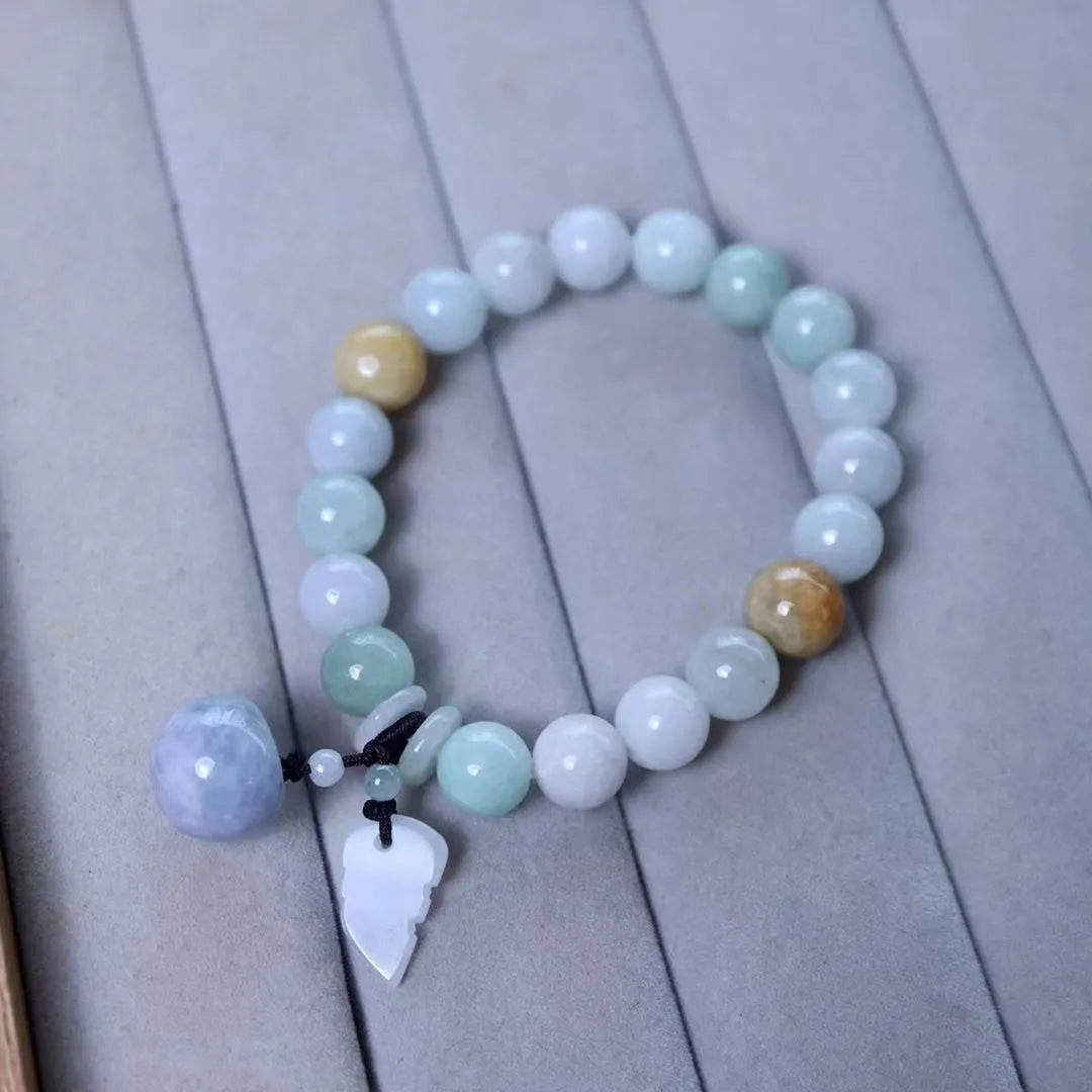 Natural green jade bracelet with geometric links and a carved Maitreya Buddha pendant.