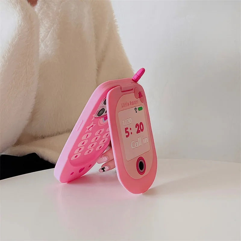 Light pink silicone flip phone case with mirror for iPhone, showing cute cartoon design.