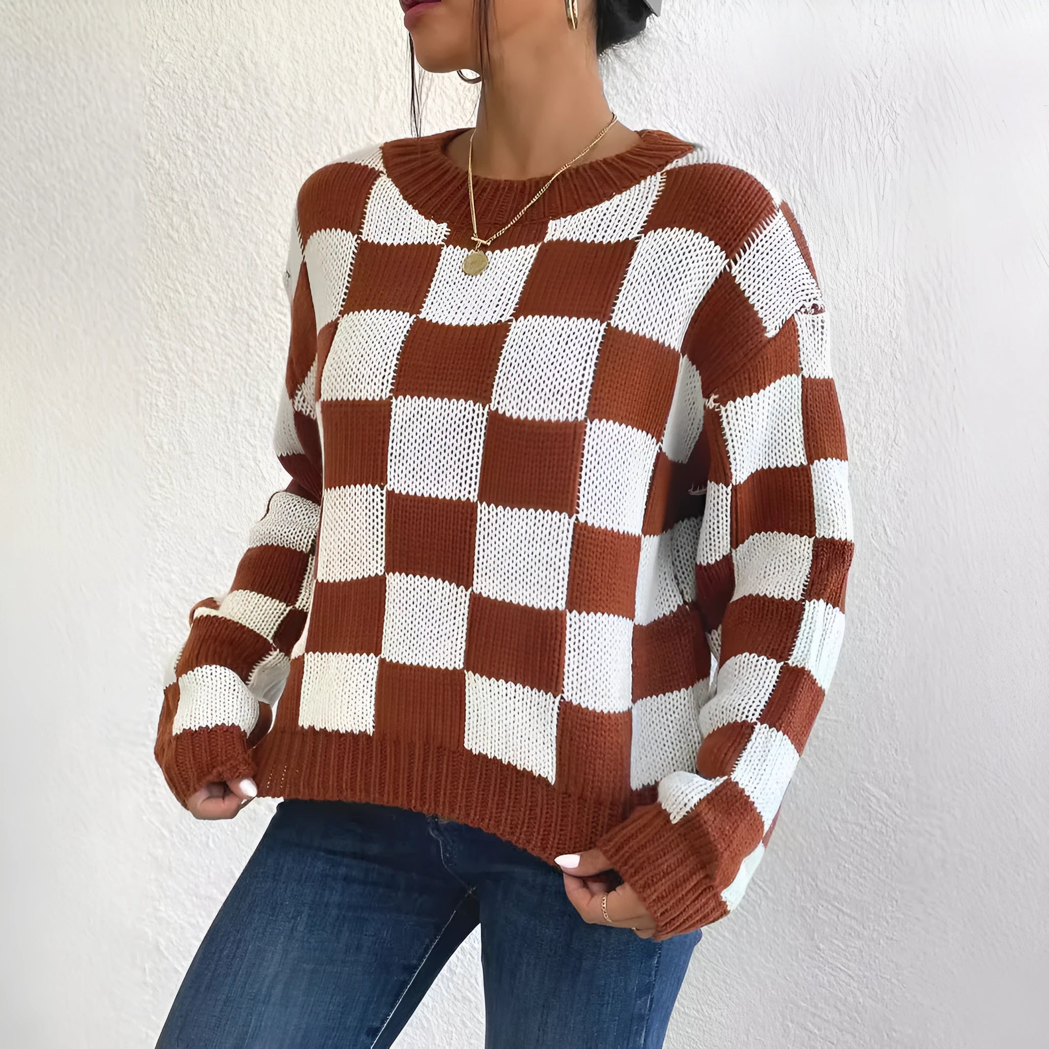 Dark brown acrylic pullover sweater with plaid chessboard pattern, loose round neck, and long sleeves