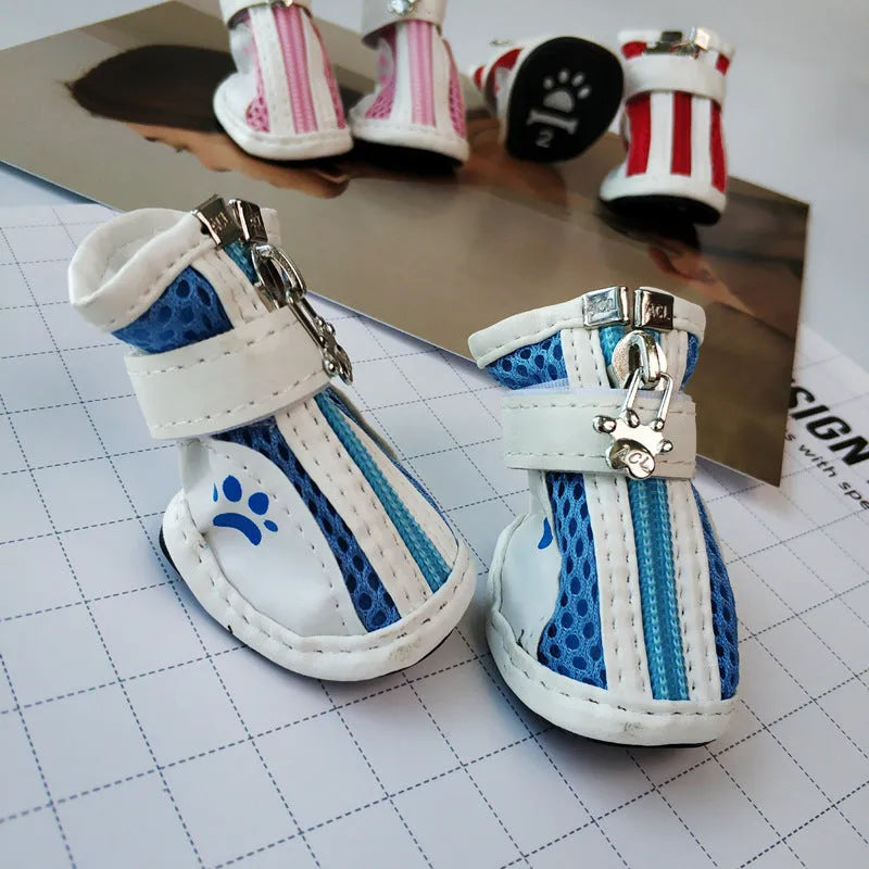 Blue zipper dog shoes with non-slip sole from a four-pair pet sneaker set.