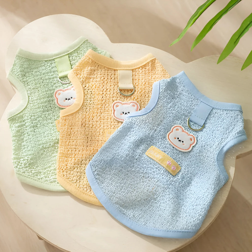 Green knitted cat top with hollowed-out design and a bear cartoon patch on the side