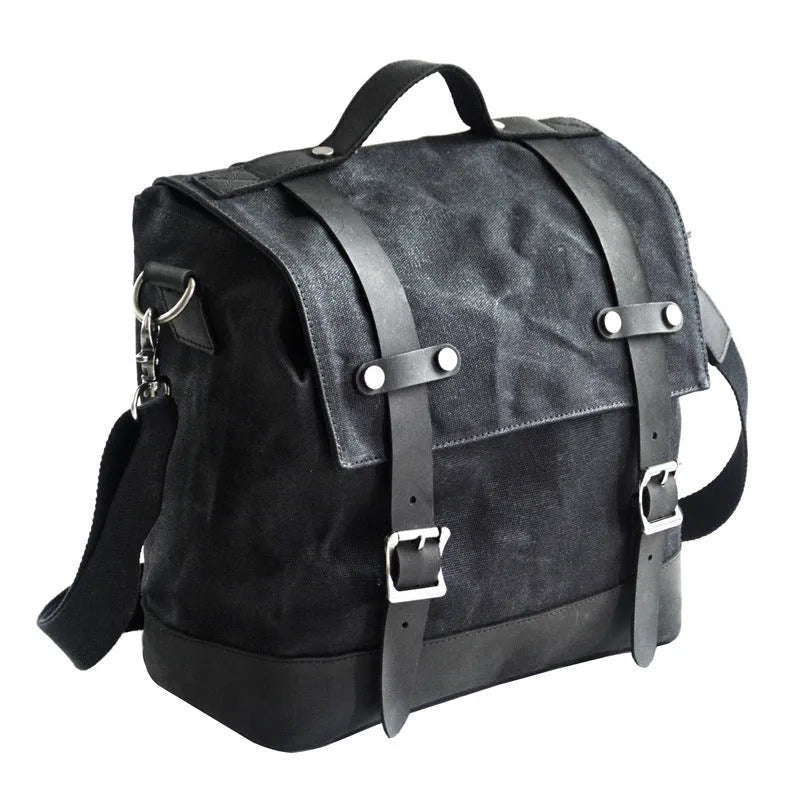 Large black waterproof canvas motorcycle side bag with cowhide top layer mounted on motorcycle