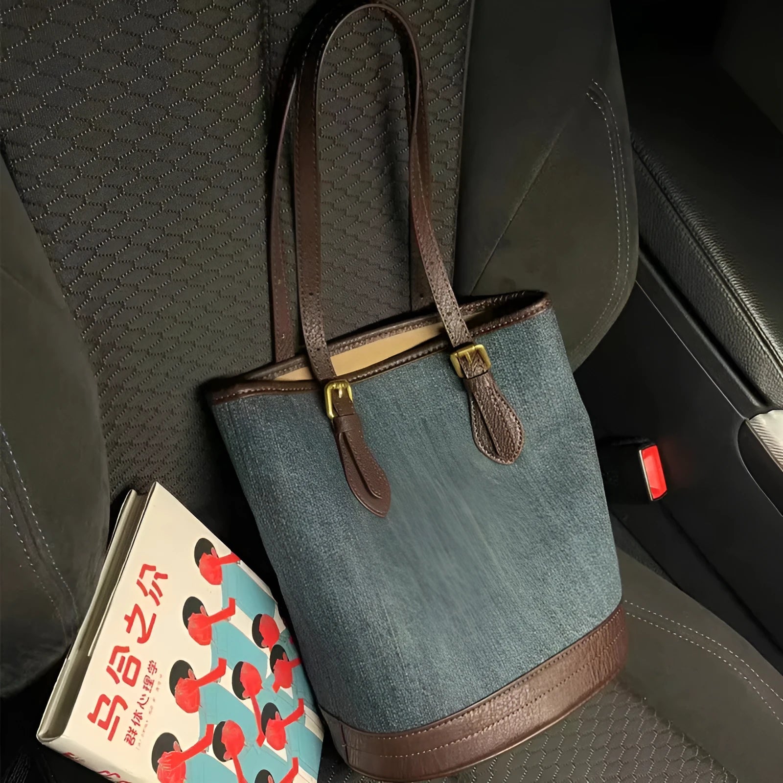 Denim patchwork one-shoulder bucket handbag showing dimensions and polyester construction