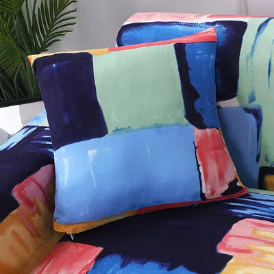 Geometric patterned stretch sofa slipcover fitted on a modern two-seater sofa.