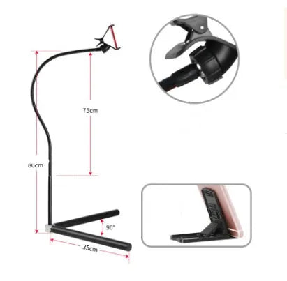 Black bedside mobile phone bracket with universal holder attached to bed frame for hands-free viewing