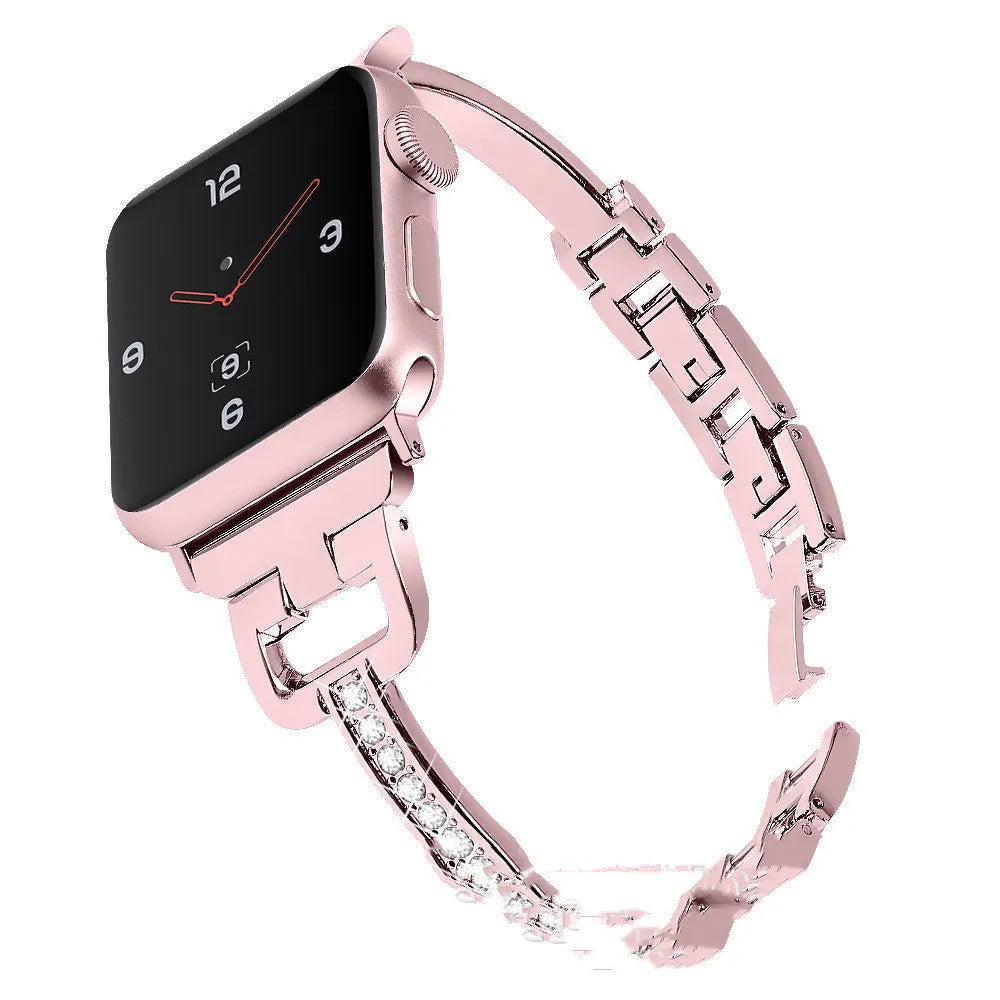 D-shaped metal diamond-pattern strap for Apple Watch in gold colour next to a smartwatch.